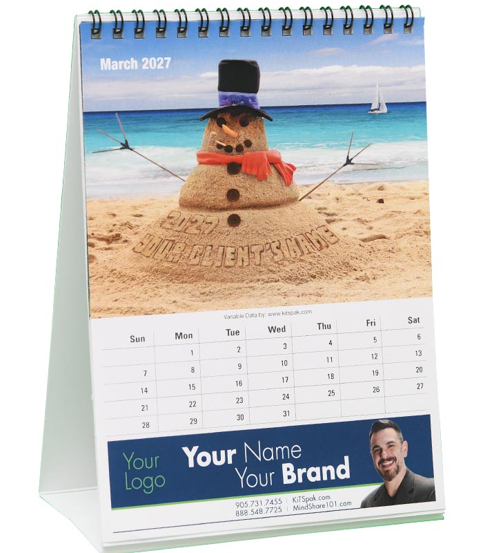 Sample March 2027 calendar page: a sand snowman on a beach with the client’s name in the sand